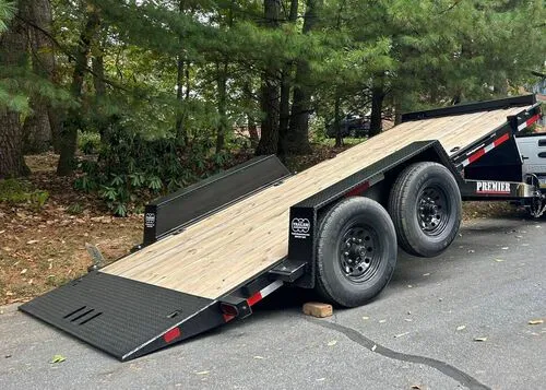 Black tandem-axle tilt trailer ready for loading